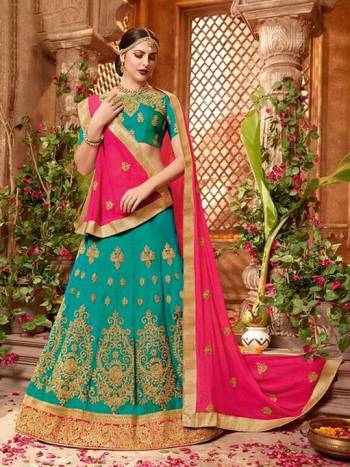 Add This Very Beautiful Designer Lehenga Choli In Turquoise Blue Color Paired With Contrasting Dark Pink Colored Dupatta. This Lehenga Choli Is Fabricated On Art Silk Paired With Chiffon Fabricated Dupatta. 