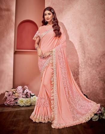 This saree is exactly what you need to spruce up your summer saree look and stay super stylish. The frill detailing makes this saree all the more fresh and young. 