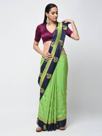 This Festive Season, Look The Most Amazing Of All Wearing This Designer Saree In Light Green Color Paired With Contrasting Wine Colored Blouse, This Saree And Blouse Are Silk Based Beautified With Jari & Resham Work. 