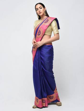 Celebrate This Festive Season With Beauty And Comfort Wearing This Designer Silk Based Saree In Royal Blue Color Paired With Contrasting Cream Colored Blouse. It Is Beautified With Embroidered Lace Border. 