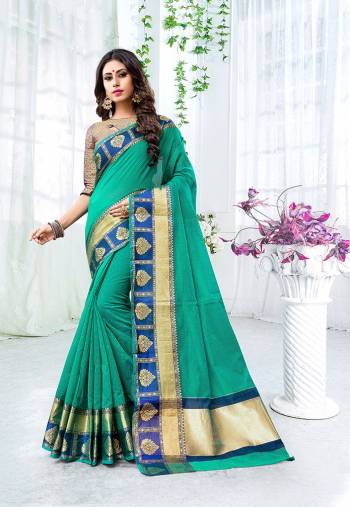 Add This Beautiful Designer Saree To Your Wardrobe For The Upcoming Festive And Wedding Season With This Silk Based Saree In Sea Green Color Paired With Contrasting Navy Blue Colored Blouse. This Saree Is Fabricated On Cotton Silk Paired With Brocade Fabricated Blouse. 