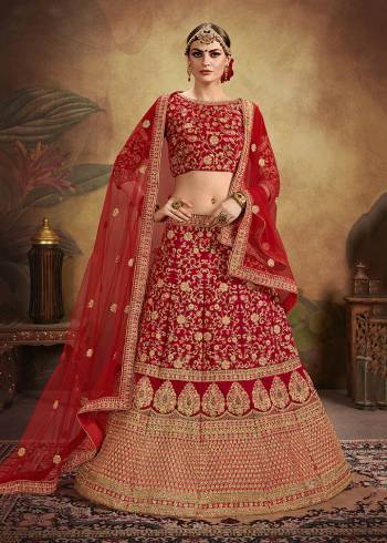 Get Ready For Your D-Day With This Heavy Designer Lehenga Choli In All Over Red Color. This Heavy Embroidered Lehenga Choli Is Fabricated On Velvet Paired With Net Fabricated Dupatta. It Is Beautified With Heavy Coding Jari Embroidery And Stone Work. Buy This Bridal Lehenga Now.