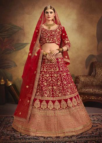 If You Want To Become The Most Attractive And Elegant Bride, Than Grab This Heavy Designer Lehenga Choli In All Over Red Color. Its Heavy Embroidered Lehenga And Choli Are Fabricated On Velvet Paired With Net Fabricated Dupatta. It Beautiful Rich Color And Clean Embroidery Will Earn You lots Of Compliments From Onlookers. 