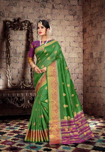 Here Is A Very Pretty Designer Saree For The Upcoming Festive And Wedding Season. Grab This Pretty Saree In Green Color Paired With Contrasting Purple Colored Blouse. This Saree Is Fabricated On Cotton Silk Paired With Art Silk Fabricated Blouse. Buy This Saree Now.