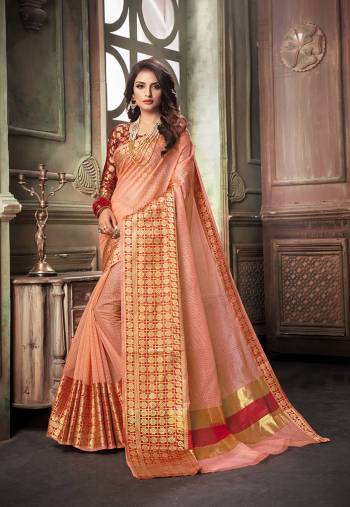 Celebrate This Festive Season With Beauty And Comfort With This Designer Saree In Peach Color Paired With Contrasting Maroon Colored Blouse. This Saree Is Fabricated On Cotton Silk Paired With Art Silk Fabricated Blouse