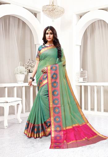 This Festive Season Be The Most Pretty And Elegant Of All Wearing This Saree In Light Green Color Paired With Contrasting Teal Blue Colored Blouse. This Saree And Blouse Are Fabricated On Cotton Silk Beautified With Weaved Lace Border. 