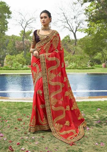 Shine Bright Wearing This Heavy Designer Saree In Orange Color Paired With Contrasting Brown Colored Blouse. This Saree Is Fabricated On Georgette Paired With Art Silk Fabricated Blouse. This Saree Is Beautified With Heavy And Attractive Embroidery Which Earn You Lots Of Compliments From Onlookers. 