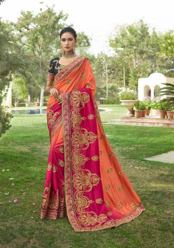 You Will Definitely Earn Lots Of Compliments Wearing This Heavy designer Saree In Orange And Pink Color Paired With Contrasting Navy Blue Colored Blouse. This Heavy Embroidered Saree And Blouse Are Fabricated On Art Silk Which Gives A Rich Look To Your Personality. 