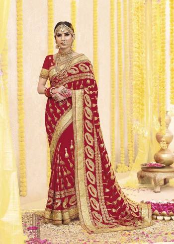 Here Is Beautiful Collection In Bridal Sarees With This Designer Saree In Red Color Paired With Red Colored Blouse. This Saree And Blouse are fabricated On Georgette Beautified With Heavy Jari Embroidery And Stone Work. This Beautiful Heavy Saree Will A Proper Bridal Look And Will Earn You Lots Of Compliments From Onlookers.
