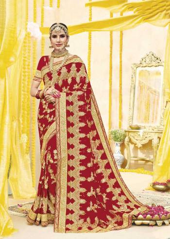Here Is Beautiful Collection In Bridal Sarees With This Designer Saree In Red Color Paired With Red Colored Blouse. This Saree And Blouse are fabricated On Georgette Beautified With Heavy Jari Embroidery And Stone Work. This Beautiful Heavy Saree Will A Proper Bridal Look And Will Earn You Lots Of Compliments From Onlookers.