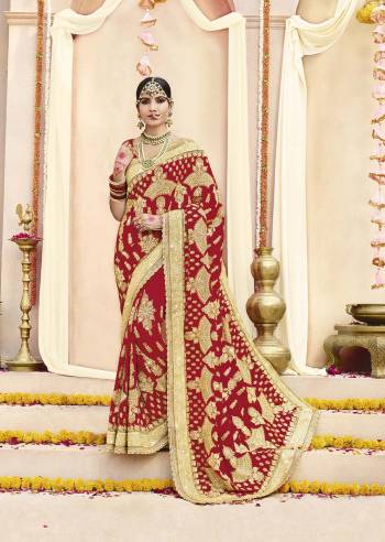 Here Is Beautiful Collection In Bridal Sarees With This Designer Saree In Red Color Paired With Red Colored Blouse. This Saree And Blouse are fabricated On Georgette Beautified With Heavy Jari Embroidery And Stone Work. This Beautiful Heavy Saree Will A Proper Bridal Look And Will Earn You Lots Of Compliments From Onlookers.