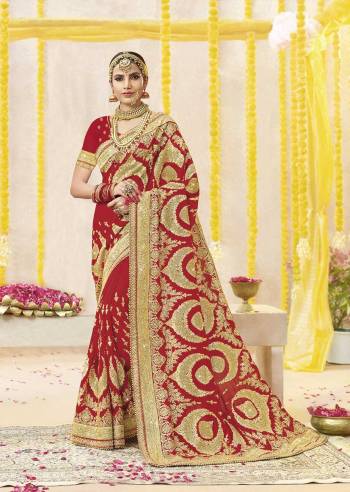 Here Is Beautiful Collection In Bridal Sarees With This Designer Saree In Red Color Paired With Red Colored Blouse. This Saree And Blouse are fabricated On Georgette Beautified With Heavy Jari Embroidery And Stone Work. This Beautiful Heavy Saree Will A Proper Bridal Look And Will Earn You Lots Of Compliments From Onlookers.