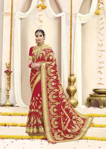 Here Is Beautiful Collection In Bridal Sarees With This Designer Saree In Red Color Paired With Red Colored Blouse. This Saree And Blouse are fabricated On Georgette Beautified With Heavy Jari Embroidery And Stone Work. This Beautiful Heavy Saree Will A Proper Bridal Look And Will Earn You Lots Of Compliments From Onlookers.