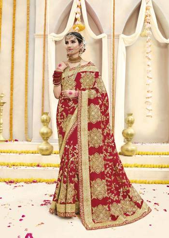 Here Is Beautiful Collection In Bridal Sarees With This Designer Saree In Red Color Paired With Red Colored Blouse. This Saree And Blouse are fabricated On Georgette Beautified With Heavy Jari Embroidery And Stone Work. This Beautiful Heavy Saree Will A Proper Bridal Look And Will Earn You Lots Of Compliments From Onlookers.