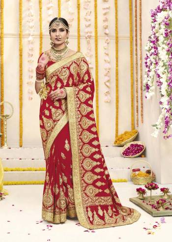 Here Is Beautiful Collection In Bridal Sarees With This Designer Saree In Red Color Paired With Red Colored Blouse. This Saree And Blouse are fabricated On Georgette Beautified With Heavy Jari Embroidery And Stone Work. This Beautiful Heavy Saree Will A Proper Bridal Look And Will Earn You Lots Of Compliments From Onlookers.