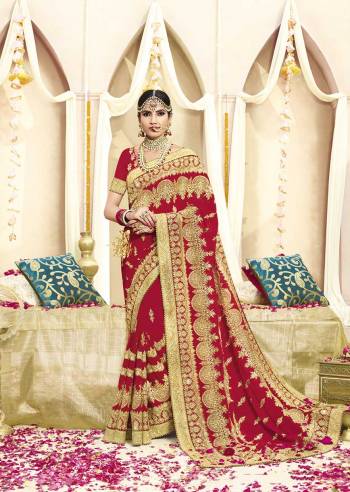 Here Is Beautiful Collection In Bridal Sarees With This Designer Saree In Red Color Paired With Red Colored Blouse. This Saree And Blouse are fabricated On Georgette Beautified With Heavy Jari Embroidery And Stone Work. This Beautiful Heavy Saree Will A Proper Bridal Look And Will Earn You Lots Of Compliments From Onlookers.