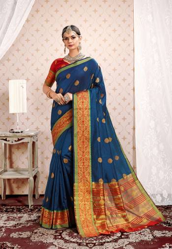This Festive Season Be The Most Pretty And Elegant Of All Wearing?This Saree In Blue Color Paired With Red Colored Blouse. This Saree And Blouse Are Fabricated On Cotton Silk Beautified With Weaved Lace Border.