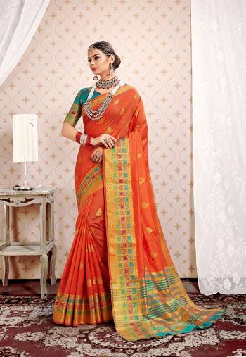 This Festive Season Be The Most Pretty And Elegant Of All Wearing?This Saree In Orange Color Paired With Turquoise Blue Colored Blouse. This Saree And Blouse Are Fabricated On Cotton Silk Beautified With Weaved Lace Border.
