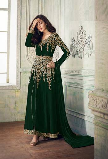 Add This Beautiful Designer To Your Wardrobe In Dark Green Color Paired With Dark Green Colored Bottom And Dupatta. Its Beautiful Embroidered Top Is Fabricated On Georgette Paired With Santoon Bottom And Chiffon Fabricated Dupatta. Its Rich Embroidery Pattern Is Giving The Suit An Attractive Look. 