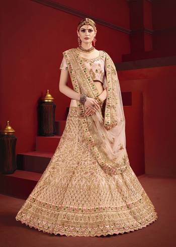 Choose A New Trend For The Bridal Look With This Heavy Designer Lehenga Choli In All Over Pastel Pink Color. This Lehenga Choli Is Fabricated On Satin Paired With Net Fabricated Dupatta. It IS Beautified With Contrasting Attractive Embroidery Which Gives A Unique Look To It. Grab This Pretty Pastel Color And Begin A New And Amazing Trend. 