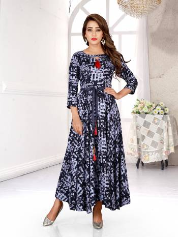 Simple And Elegant Looking Readymade Gown Is Here In Shades Of Grey. This Pretty Gown Is Fabricated On Rayon Beautified With All Over Prints. 