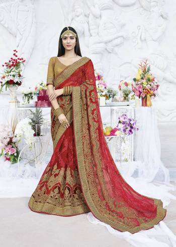 Adorn The Pretty Angelic Look Wearing This Heavy Designer Saree In Red Color Paired With Beige Colored Blouse. This Heavy Embroidered Saree Is Net Based Paired With Art Silk Fabricated Blouse. Buy Now.