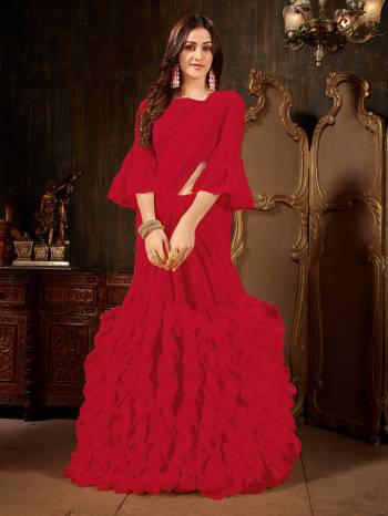 Add This Beautiful Designer Ruffled Saree To Your Wardrobe In Red Color For The Upcoming Festive And Wedding Season. This Trendy Saree Is Fabricated On Georgette Paired With Art Silk And Georgette Fabricated Blouse. Its Trendy Pattern And Pretty Color Will EArn You Lots Of Compliments From Onlookers. 