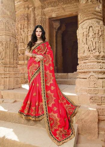 Adorn The Pretty Angelic Look Wearing This Heavy Designer Shaded Saree In Crimson Red Color Paired With Maroon Colored Blouse. This Saree Is Silk Georgette Based Paired With Art Silk Fabricated Blouse. 