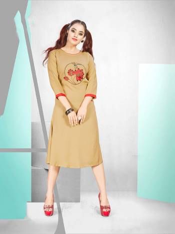 Simple And elegant Looking Readymade Designer Kurti Is Here For Your Semi-Casuals In Beige Color. It Is Fabricated Rayon Which IS Soft Towards Skin And Ensures Superb Comfort All Day Long. 