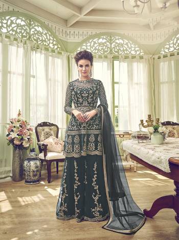 New Shade Is Here To Add Into Your Wardrobe With This Designer Semi-Stitched Suit In Pine Green Color. Its Top, Bottom And Dupatt aAre Fabricated On Net Beautified With Heavy Embroidery. 