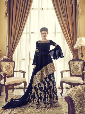 For A Bold And Beautiful Look, Grab This New And Designer Patterend Indo-Western Suit In Navy Blue. Its Top, Bottom And Dupatta Are Fabricated On Georgette Beautified With Heavy Embroidery. Buy Now.