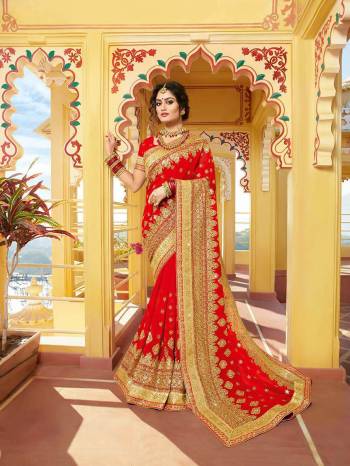 Look Attractively Beautiful In This Heavy Designer Saree In Red. This Saree Is Georgette Based Beautified With Heavy Embroidery. This Pretty Saree Is Durable And Easy To Carry Throughout The Gala.