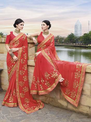 Adorn This Pretty Angelic Look Wearing This Designer Saree In Red Color Paired With Red Colored Blouse. This Saree Is Georgette Based Paired With Art Silk Fabricated Blouse. It Is Easy To Drape And Carry All Day Long. 