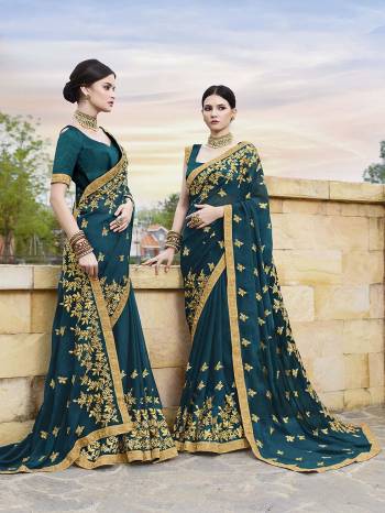 New Shade Is Here To add Into Your Wardrobe With This Heavy Designer Saree In Prussian Blue Color Paired With Prussian Blue Colored Blouse. This Saree Is Georgette Based Paired With Art Silk Fabricated Blouse. 