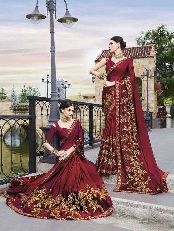 For A Royal And Elegant Look, Grab This Beautiful Designer Saree In Maroon Color Paired With Maroon Colored Blouse. This Attractively Embroidered Saree Is Silk Georgette Based Paired With Art Silk Fabricated Blouse. Buy This Saree Now.