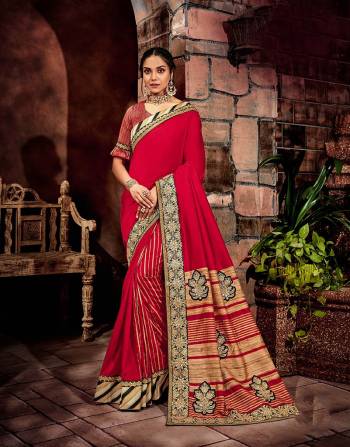 A meticulous match of stripes and floral details in classic shade of red , black and gold is a pivotal aspect of this saree.  Add a choker necklace to perfect the look. 