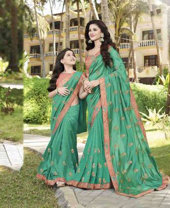 Catch All The Limelight At The Next Party To Attend Wearing This Designer Saree In Sea Green Color Paired With Contrasting Peach Colored Blouse. This Saree Is Fabricated On Georgette Paired With Art Silk Fabricated Blouse. Buy Now.