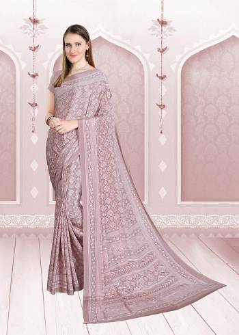 Add Some Casuals With This Pretty Saree Fabricated On Crepe. This Saree And Blouse are Beautified With prints And It Is Light Weight And Easy To Carry All Day Long. 