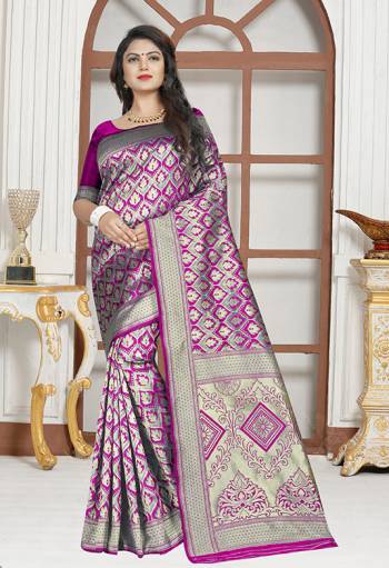 Here Is A Very Pretty Designer Saree In Purple Color Paired With Purple Colored Blouse. This Saree And Blouse are Silk Based Beautified With Paisly Weave All Over It. Buy This Saree Now.