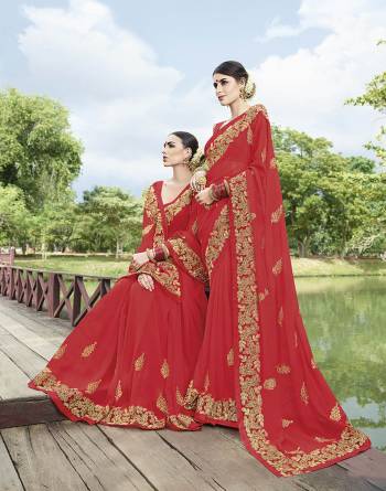 Adorn The Pretty Angelic Look Wearing This Very Beautiful Designer Saree In Red Color Paired With Red Colored Blouse. This Saree Is Georgette Based Paired With Art Silk Fabricated Blouse. Buy Now.