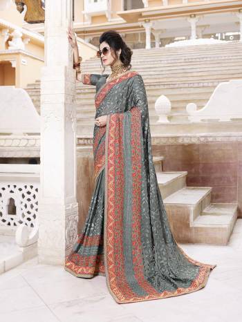 Flaunt Your Rich And Elegant Taste Wearing This Heavy Designer Saree With Tone To Tone Emnbroidery In Grey Color Paired With Grey Colored Blouse. This Pretty Saree Is Chiffon Based Paired With Art Silk Fabricated Blouse. 