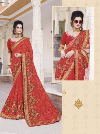 Adorn The Pretty Angelic Look In This Very Pretty Designer Saree In Red Color paired With Red Colored Blouse. This Saree IS Fabricated On Georgette Beautified With Tone To Tone Work Paired With Art Silk Fabricated Blouse. 