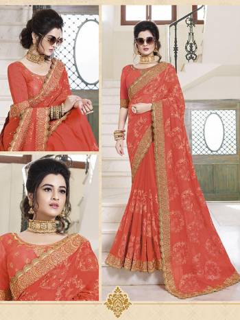 Celebrate This Festive Season Wearing This Very Pretty And Attractive Looking Designer Saree In Orange Color paired With Orange Colored Blouse. This Saree IS Fabricated On Georgette Paired With Art Silk Fabricated Blouse. It Is Light Weight And Easy To CArry Throughout The Gala.