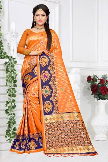 Celebrate This Festive With Traditional Colors Wearing This Pretty Saree In Orange Color Paired With Orange Colored Blouse. This Saree And Blouse are Fabricated On Art Silk Beautified With Weave All Over. Buy This Saree Now.