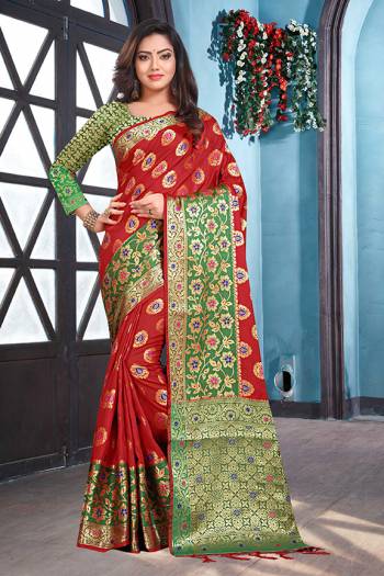 For A Proper Traditional Look, Grab This Designer Silk Based Saree In Red Color Paired With Contrasting Green Colored Blouse. This Saree And Blouse are Fabricated On Soft Silk Beautified With Weave. 