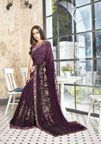 You Will Definitely Earn Lots Of Compliments Wearing This Pretty Saree In Dark Purple Color. This Saree Is Georgette Based Beautified With Foil And Floral Prints. It Is Soft Towards Skin And Easy To Carry All Day Long. 
