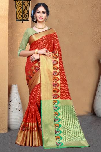 Celebrate This Festive Season With Beauty And Comfort Wearing This Designer Silk Based Saree In Red Color Paired With Contrasting Green Colored Blouse. This Saree And Blouse Are Fabricated On Patola Art Silk Beautified With Weave. 