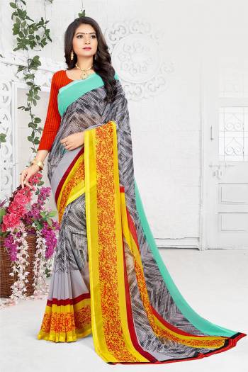 For Your Casual Wear, Grab This Simple Saree In Grey And Yellow Color Paired With Contrasting Red Colored Blouse. This Saree And Blouse Are Fabricated On Georgette Beautified With Prints All Over, Buy Now.