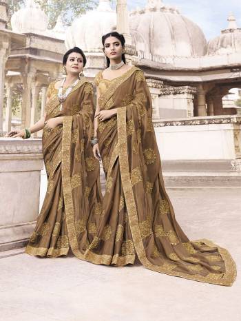 Flaunt Your Rich And Elegant Taste With This Very Pretty And Elegant Color Pallete. This Saree Is In Light Brown Color Paired With Beige Colored Blouse. It Is Fabricated On Chiffon Paired With Art Silk Fabricated Blouse. Its Rich Color And Embroidery Will Give An Elegant Look To Your Personality. 