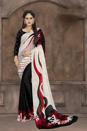 Add Some Casuals To Your Wardrobe With This Printed Saree In White And Black Color Paired With Black Colored Blouse. This Saree And Blouse Are Fabricated On Crepe Jacquard Beautified With Prints. 